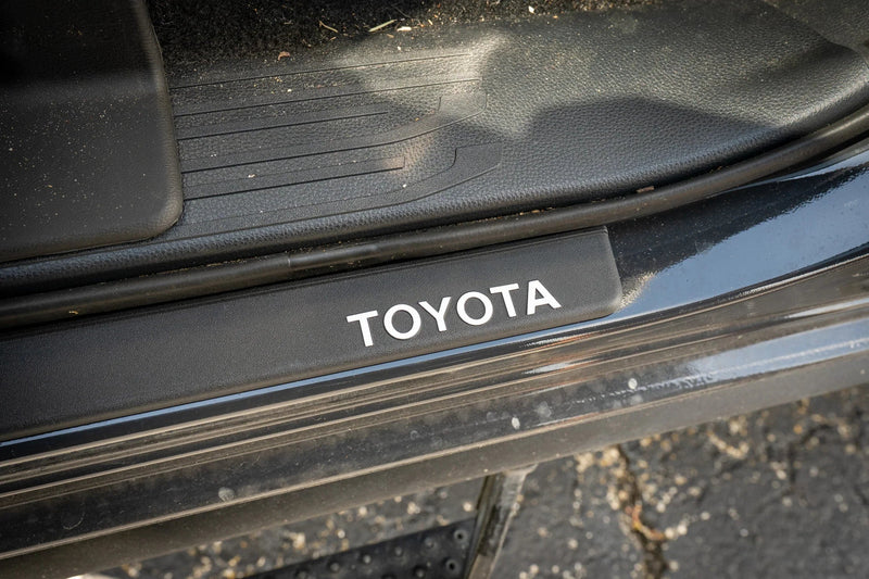 Load image into Gallery viewer, TOYOTA Front Door Sill Letter Overlays - 2024+ Tacoma / 2025+ 4Runner
